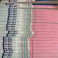 最上边是早孕试纸，下边是排卵试纸 一天两次，早一次晚一次，到今天晚上的，请大家帮帮我，这是排卵了没...