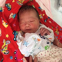 恩泽及舍下，公子至我家。 身经十月苦，骨开十指难。 乔治七斤七，偕母同平安。此乃心头肉，望子一生安！