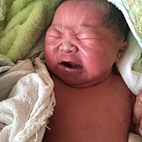羊水偏少，催生的，顺产 男   7斤2两